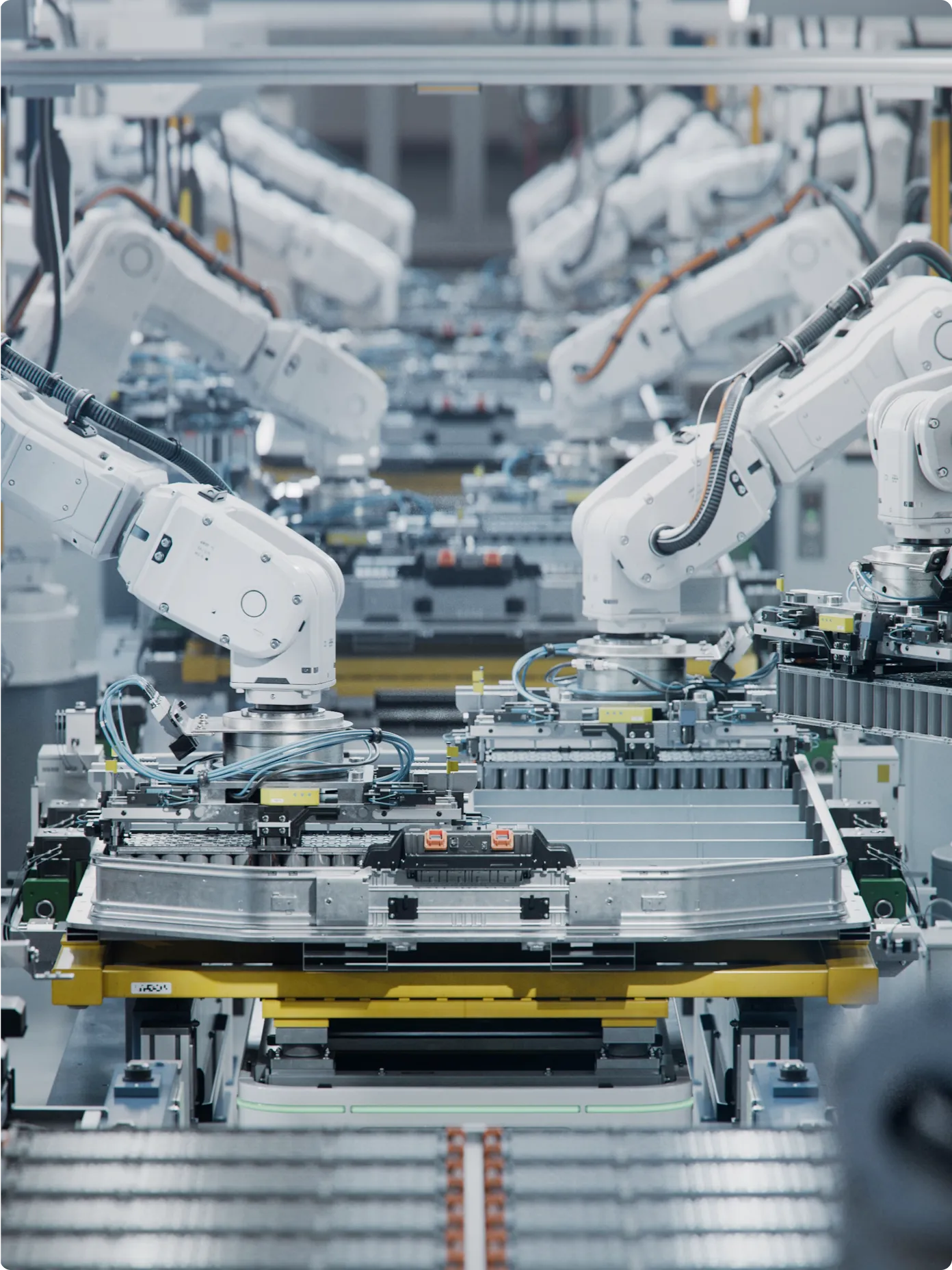 Robots efficiently assembling products on factory lines, showcasing advanced automation in a manufacturing environment.