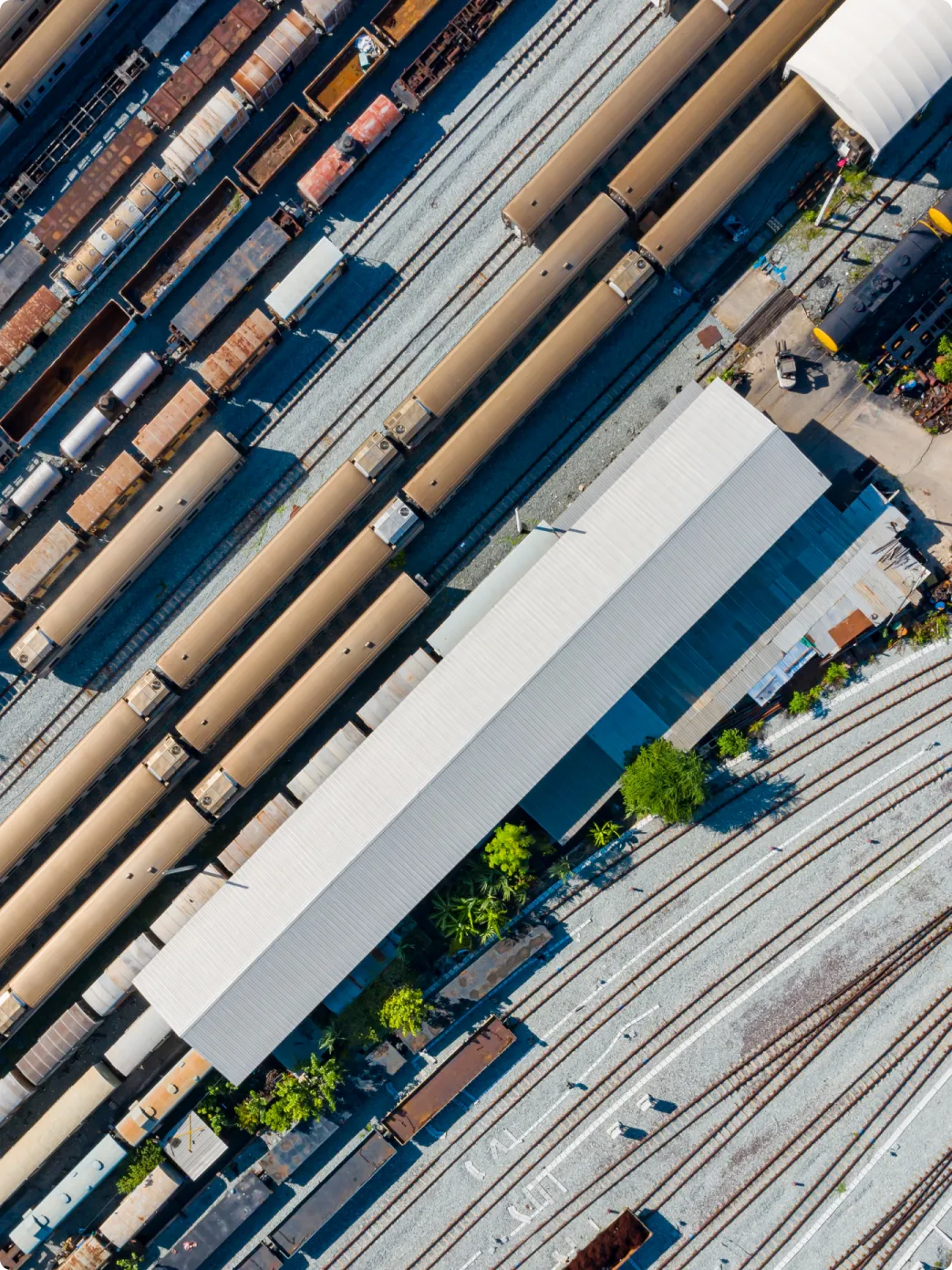 Aerial view of a train yard filled with numerous trains parked on tracks, showcasing the layout and organization of the yard.
