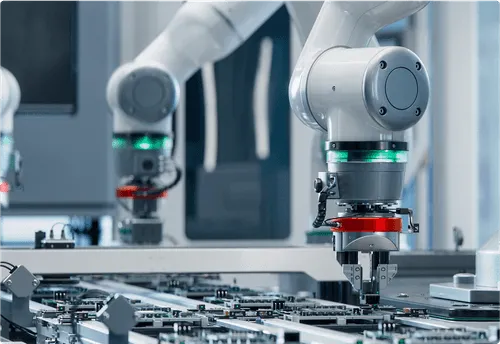 Robotic arm works on a circuit board showcasing advanced industrial automation.