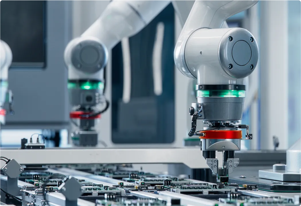 Robotic arm works on a circuit board showcasing advanced industrial automation.