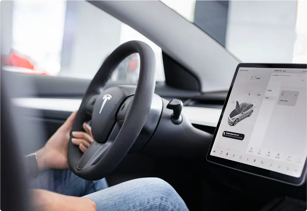 Driver's view of a connected car's dashboard screen with integrated applications.