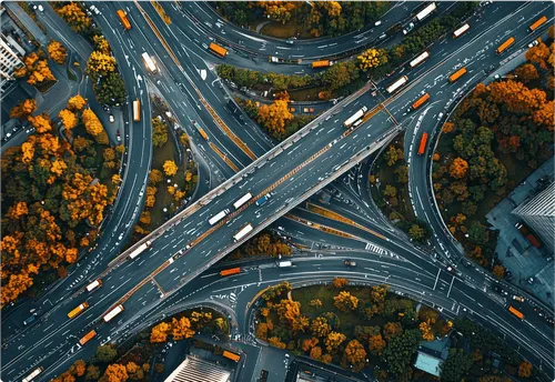 Aerial view of a busy city street grid and buildings representing urban interconnectivity.