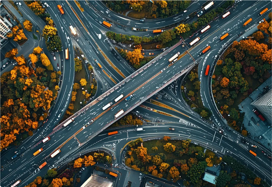 Aerial view of a busy city street grid and buildings representing urban interconnectivity.