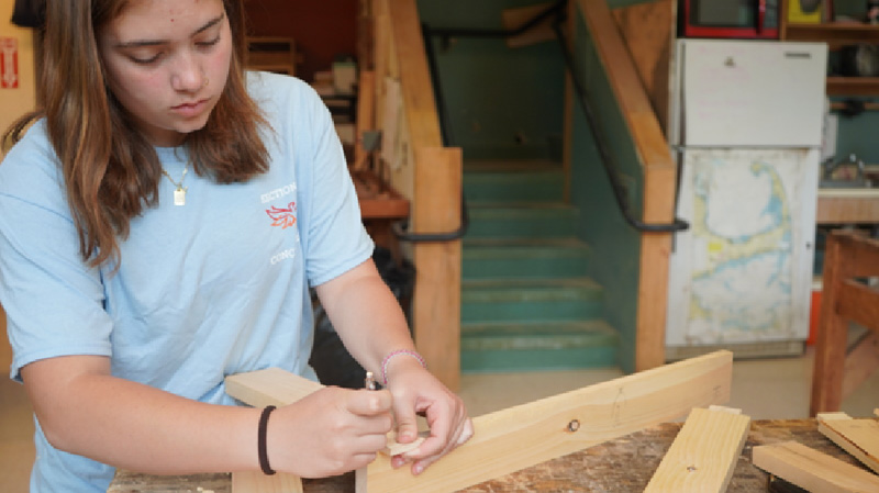 Image of a student working on a carpentry project.