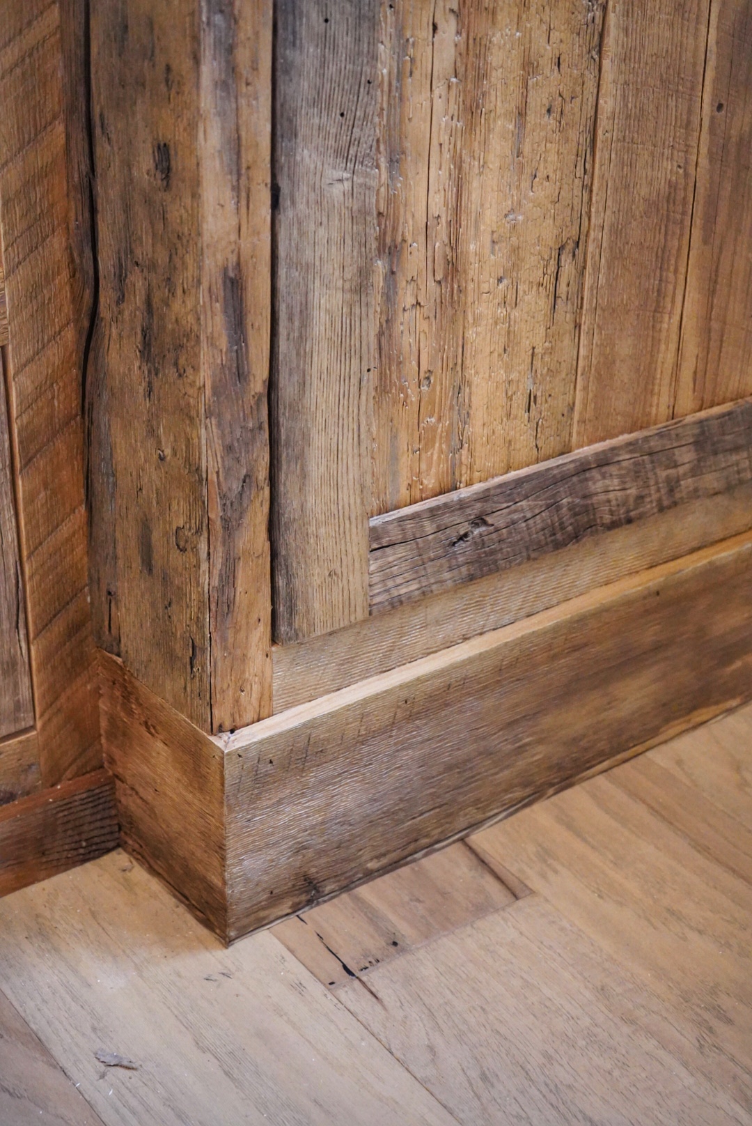Project detail: Close up of the bottom corner of the custom reclaimed built-in.
