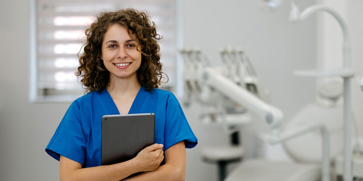 dentist holding tablet in treatment area