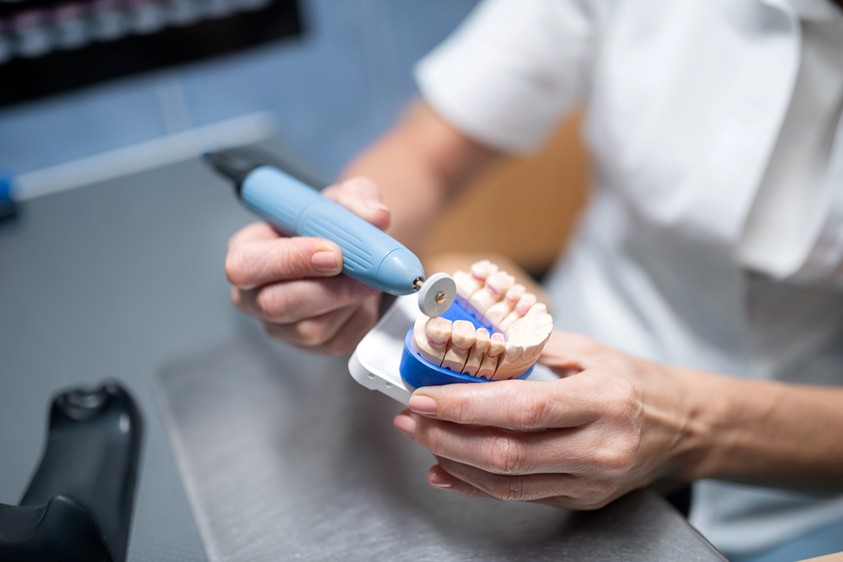 dental lab technician working on impression