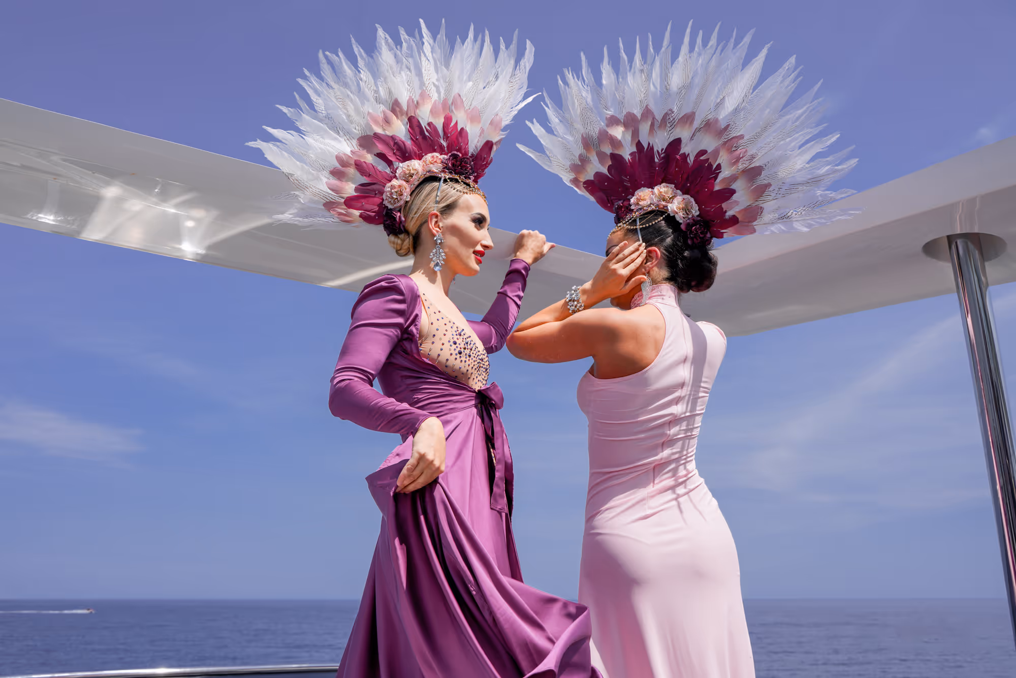 young female animators in costumes on a yacht charter