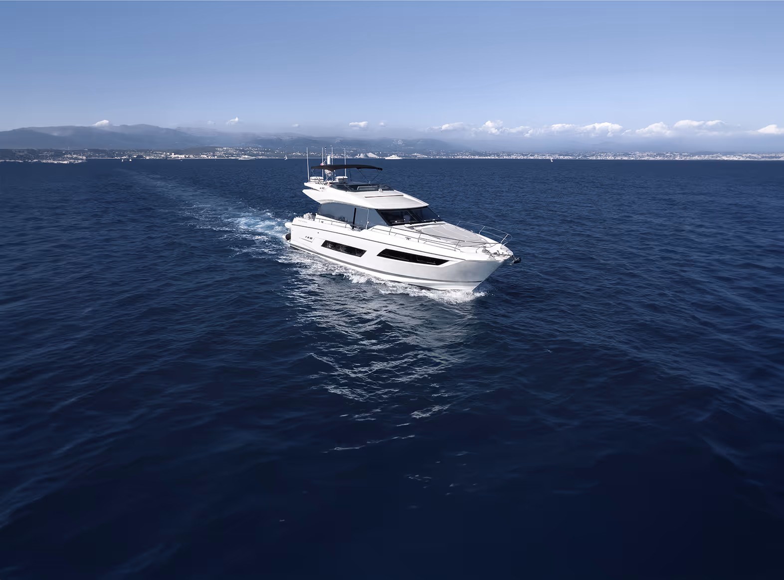 Prestige 680 motor yacht "Apollonia" cruises in the open sea.