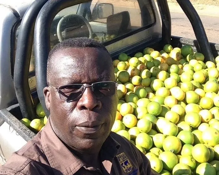 George Chanda with a truck full of food