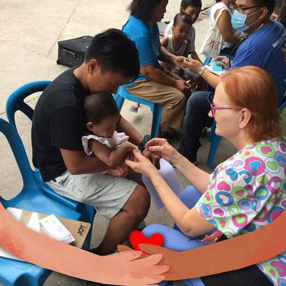 Joyce Fulton treating a baby