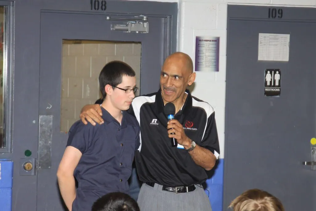 Tony Dungy encourages young man during One Heart event
