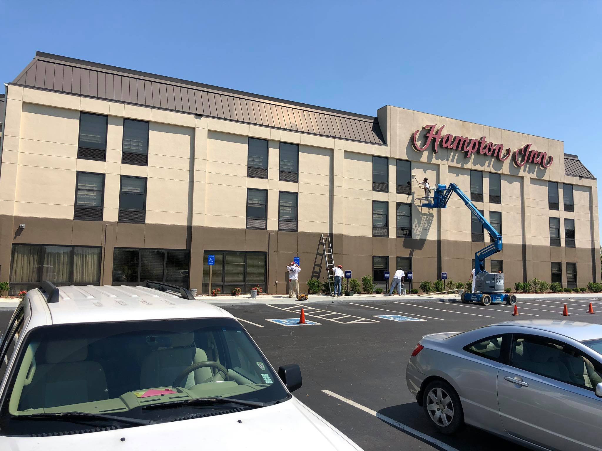 Painting the outside of the Hampton Inn