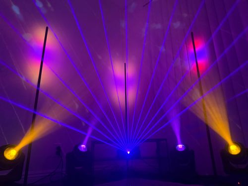 image of a dj setup in a dimly lit club