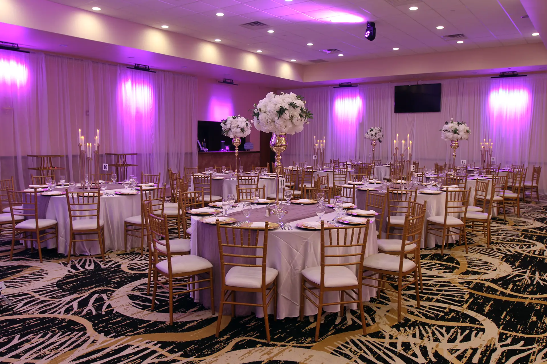 Decorated Banquet Tables in Venue Ballroom