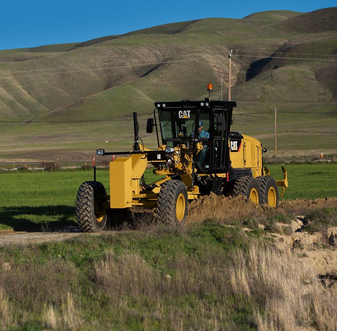 CAT machine in a field in Texas Rented to a happy customer

