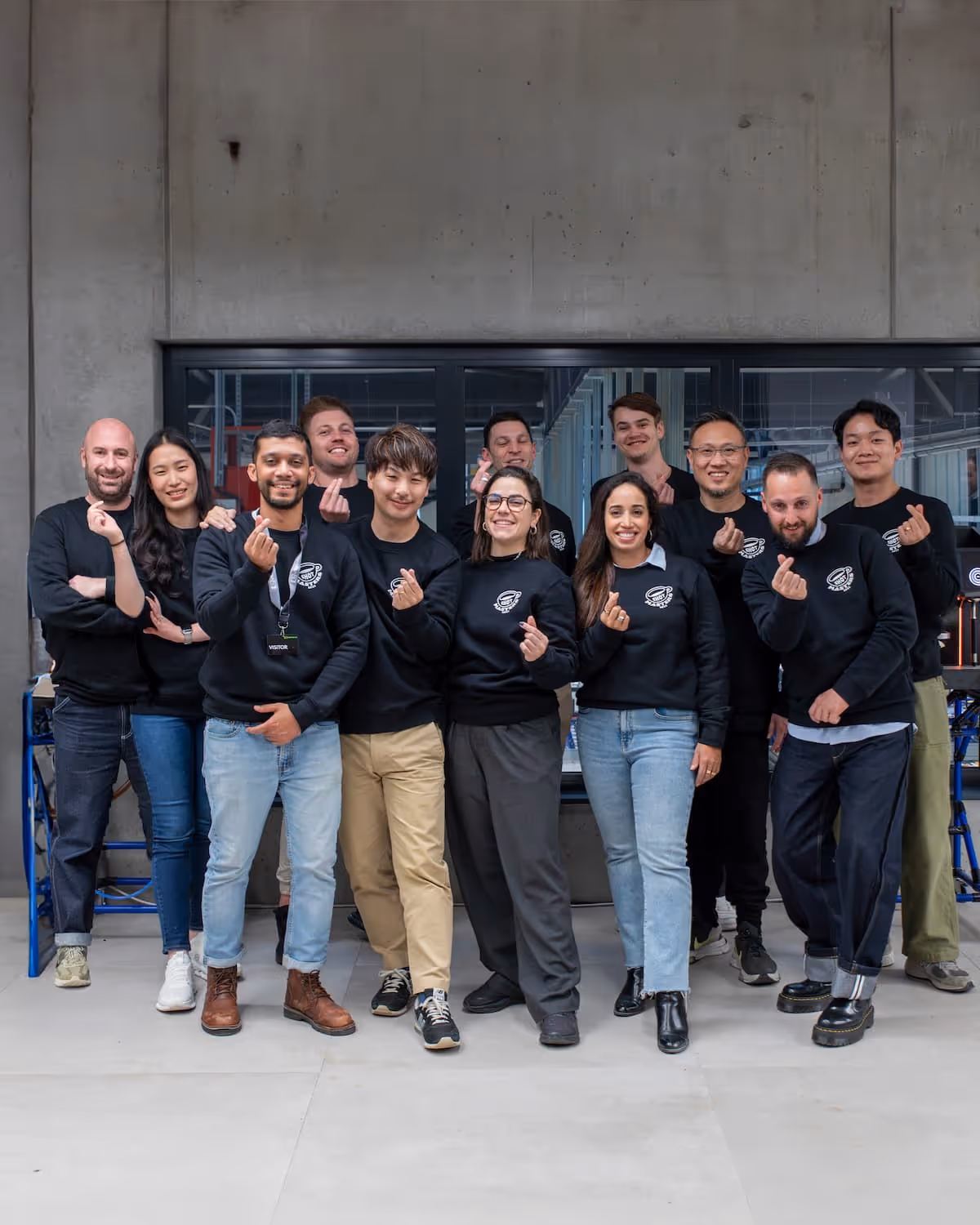 Group photo at the World of Coffee with Eversys Shotmasters