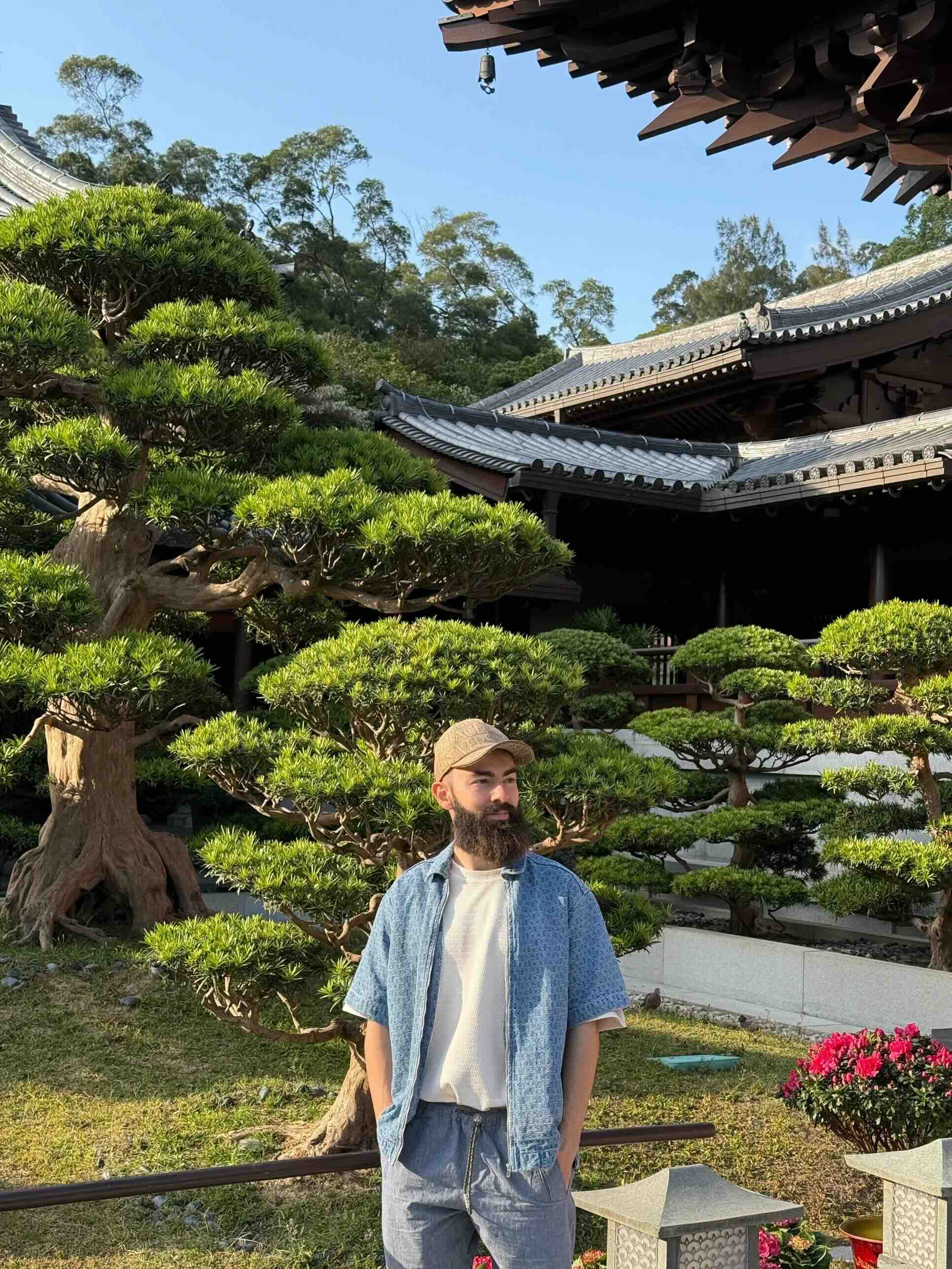A person standing in a Japanese garden
