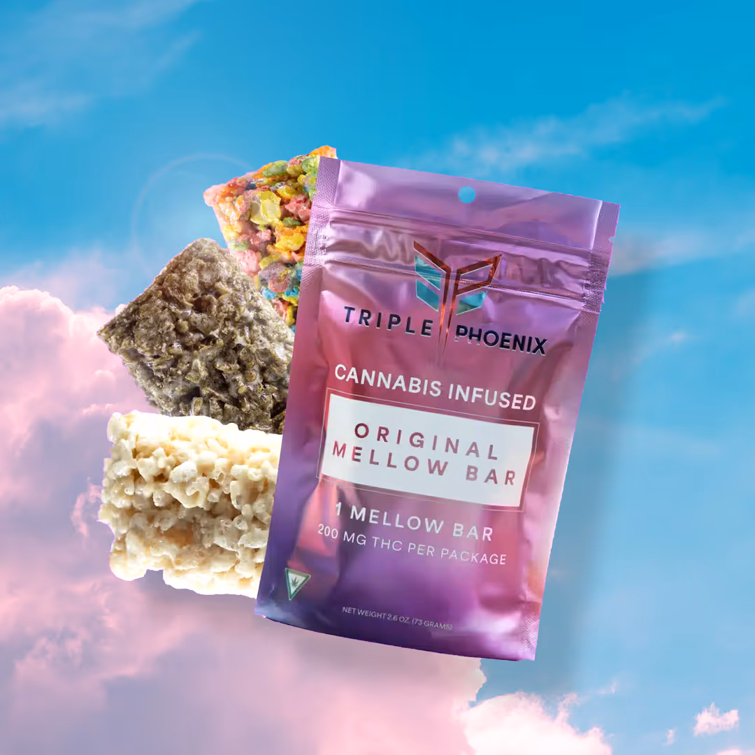 Triple Phoenix cannabis-infused mellow bar with colorful treats on cloudy background