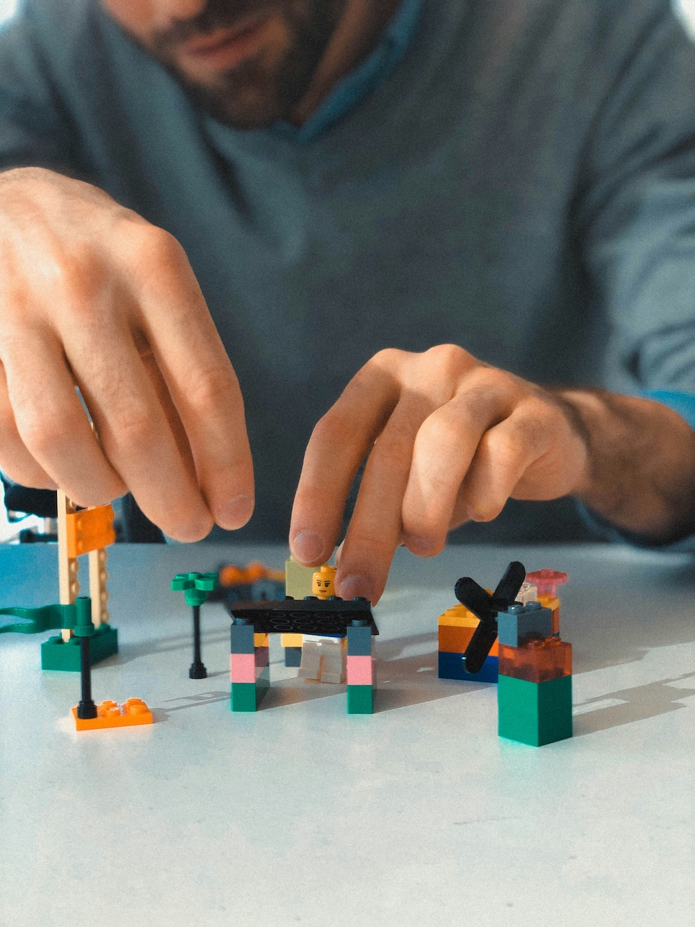 A man experimenting with Legos