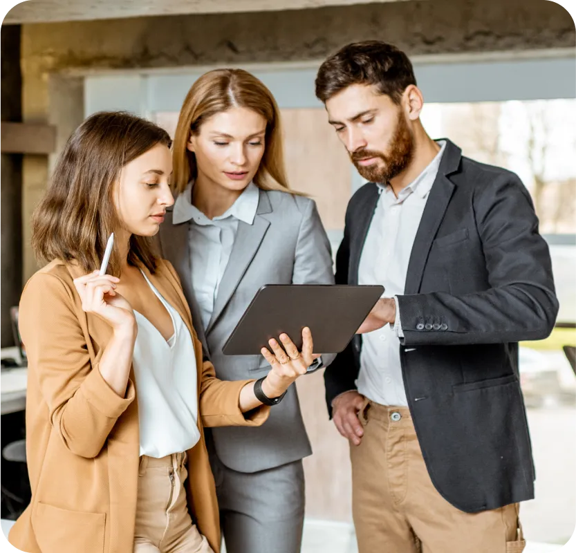 A man and woman looking at something on a clipboard.
