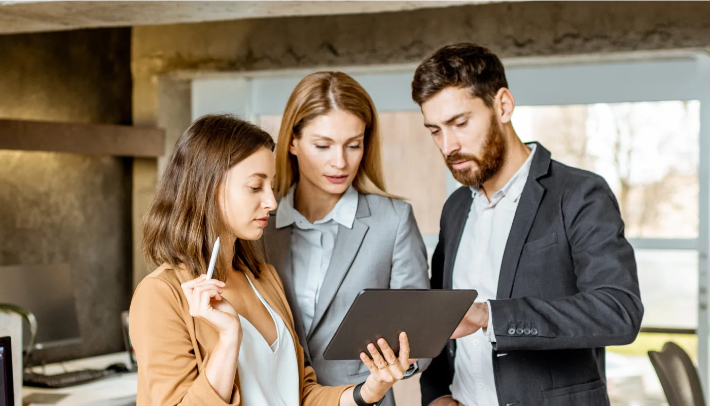 A man and woman looking at something on a clipboard.