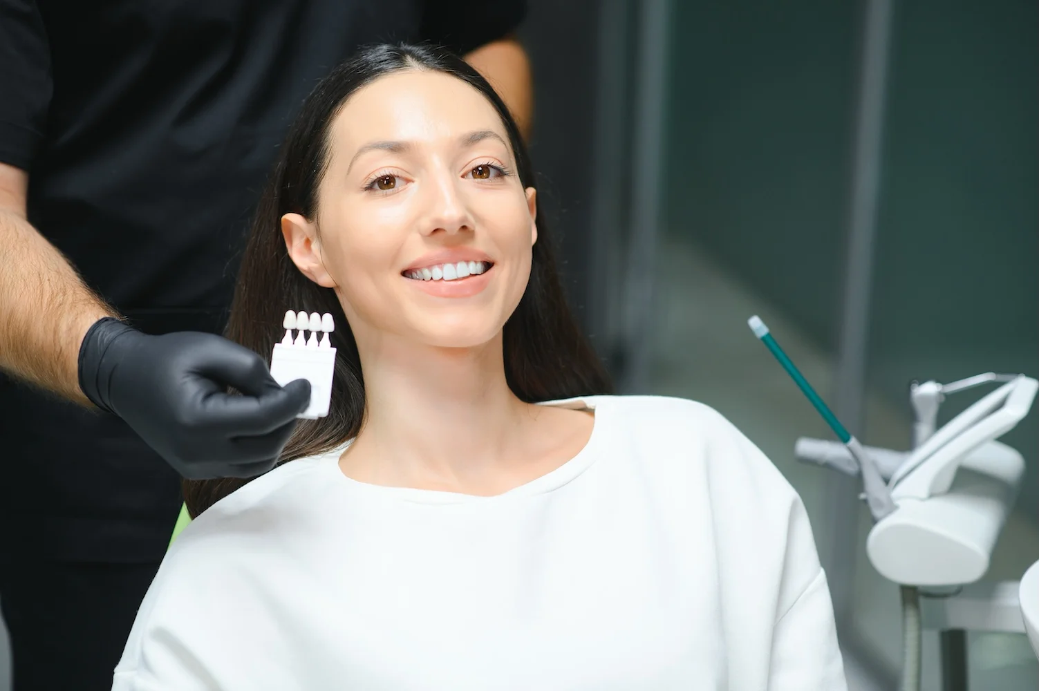 Caucasian Female Patient Smiling in Dental Office