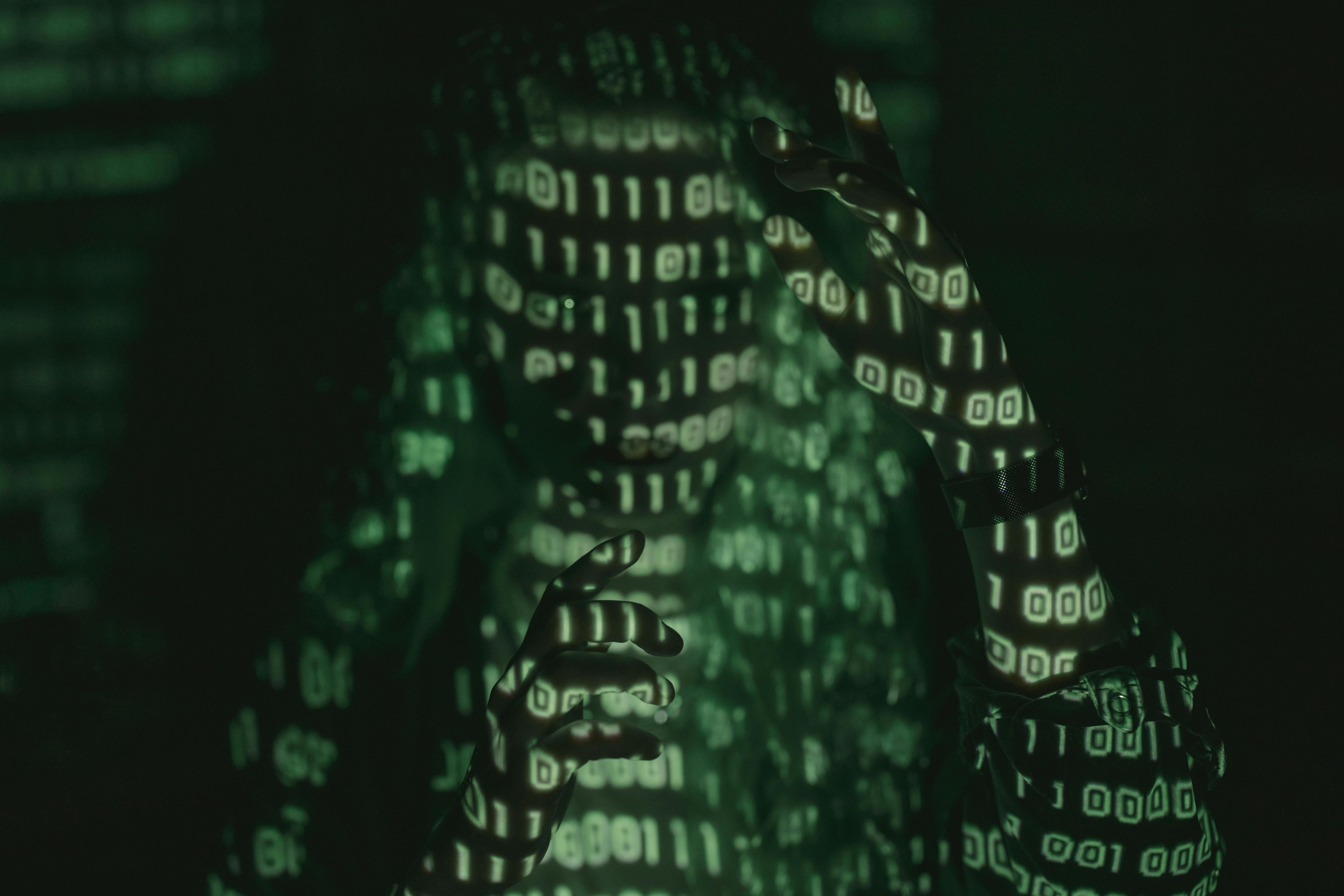 A abstract picture of a human in front of code