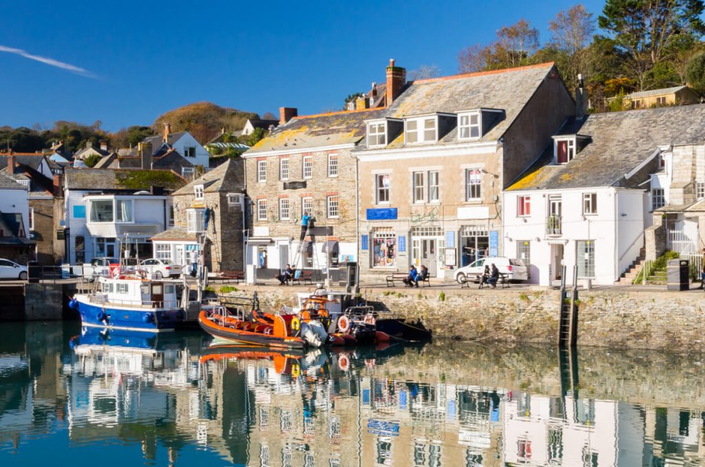 Padstow harbourfront with fishing boats and waterfront cottages on the Camel Estuary in Cornwall
