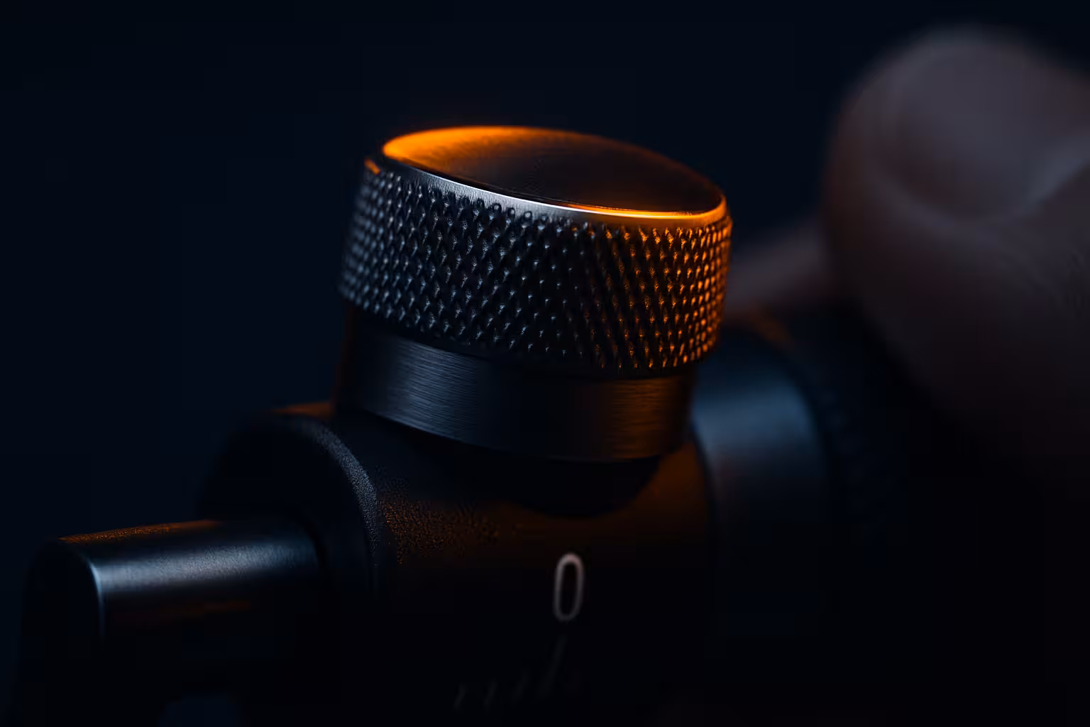 A thumb adjusting a precision measurement dial - qualification and discovery.