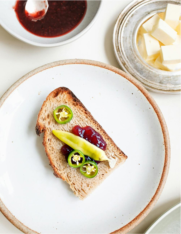 photo of bread with jam an chillies