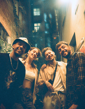 smiling friends group in a berlin backyard