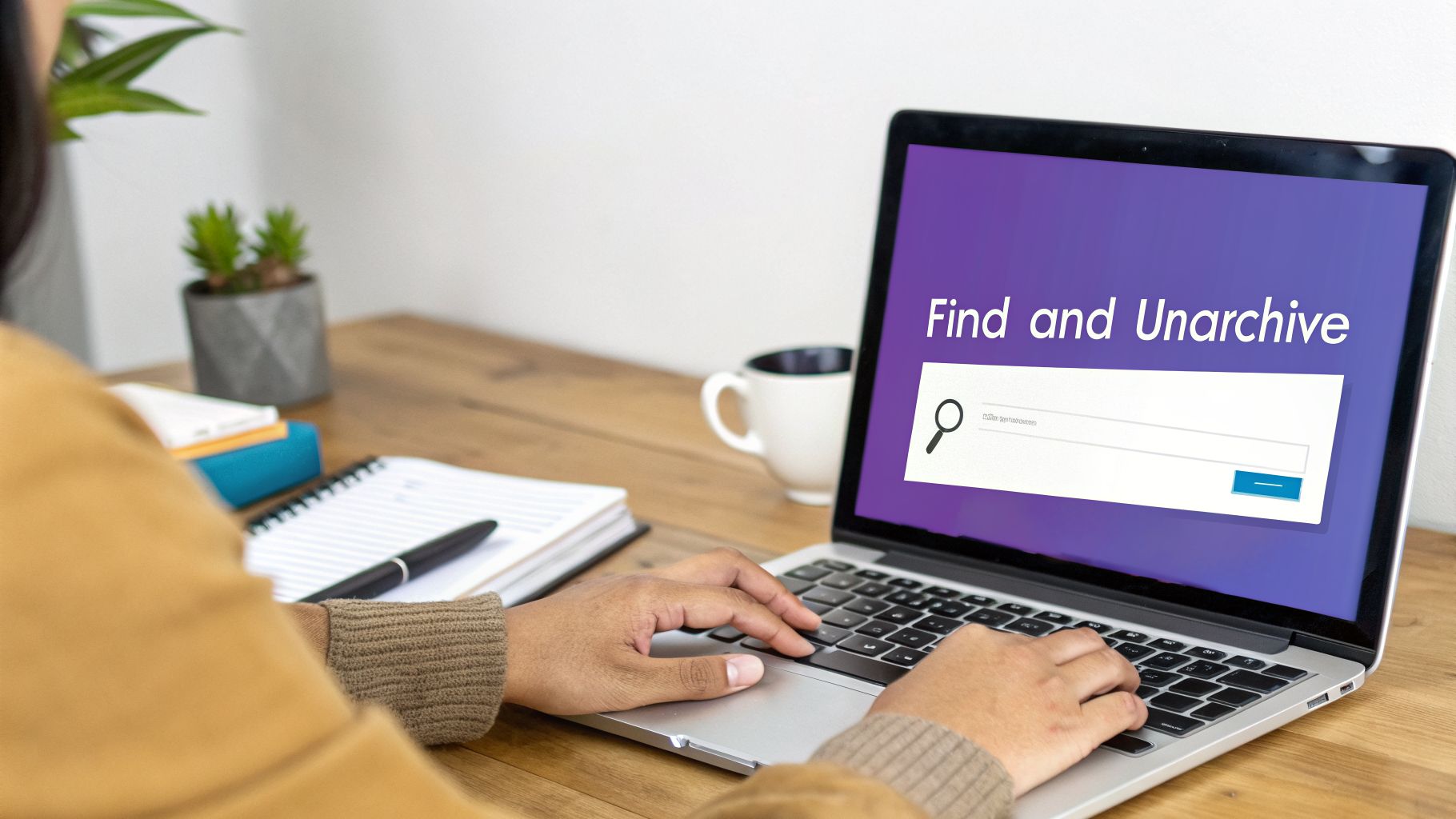 Person typing on a laptop, searching to 'Find and Unarchive' files on a purple screen.