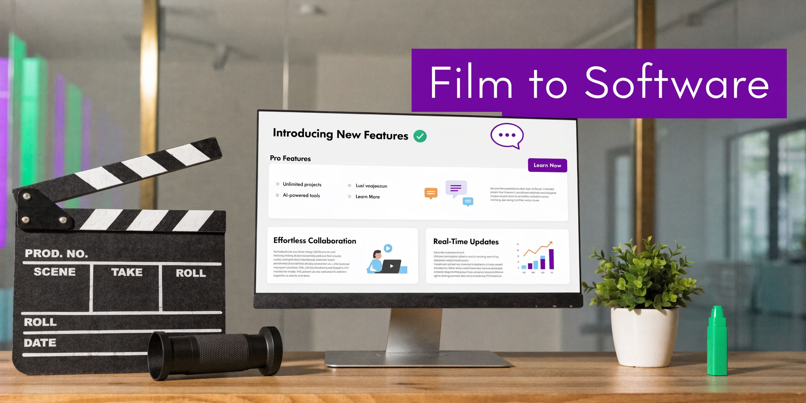 A professional desk featuring a film clapperboard, a computer monitor displaying software features, and a small plant.
