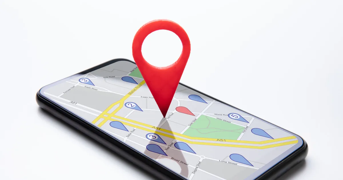 Pin icon over a map displayed on a smartphone