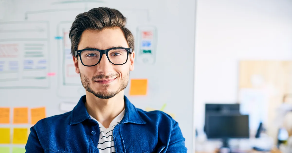 Successful Website Designer standing.