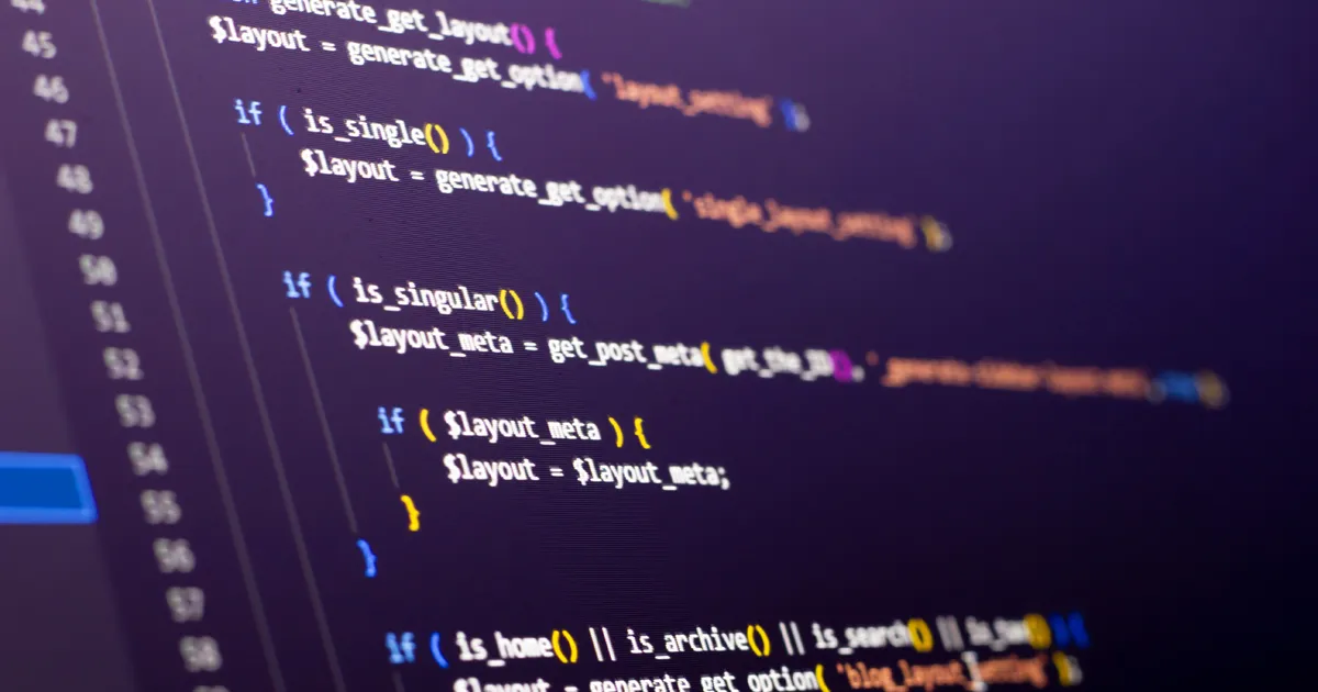 The software developer is doing php coding. Abstract code background. Selective focus code on computer screen.