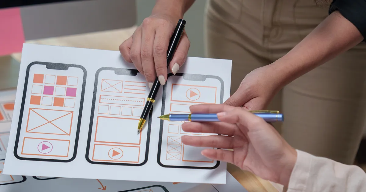 Uiux designers are discussing mobile app templates, focusing on user interface and user experience design for a seamless and intuitive mobile application.