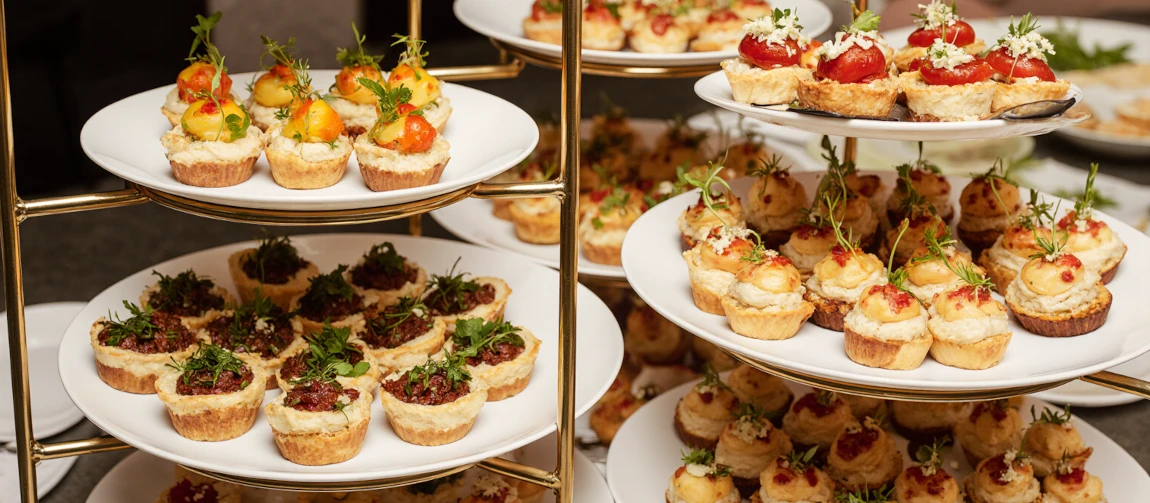 Image of multiple platters for a fingerfood buffet.