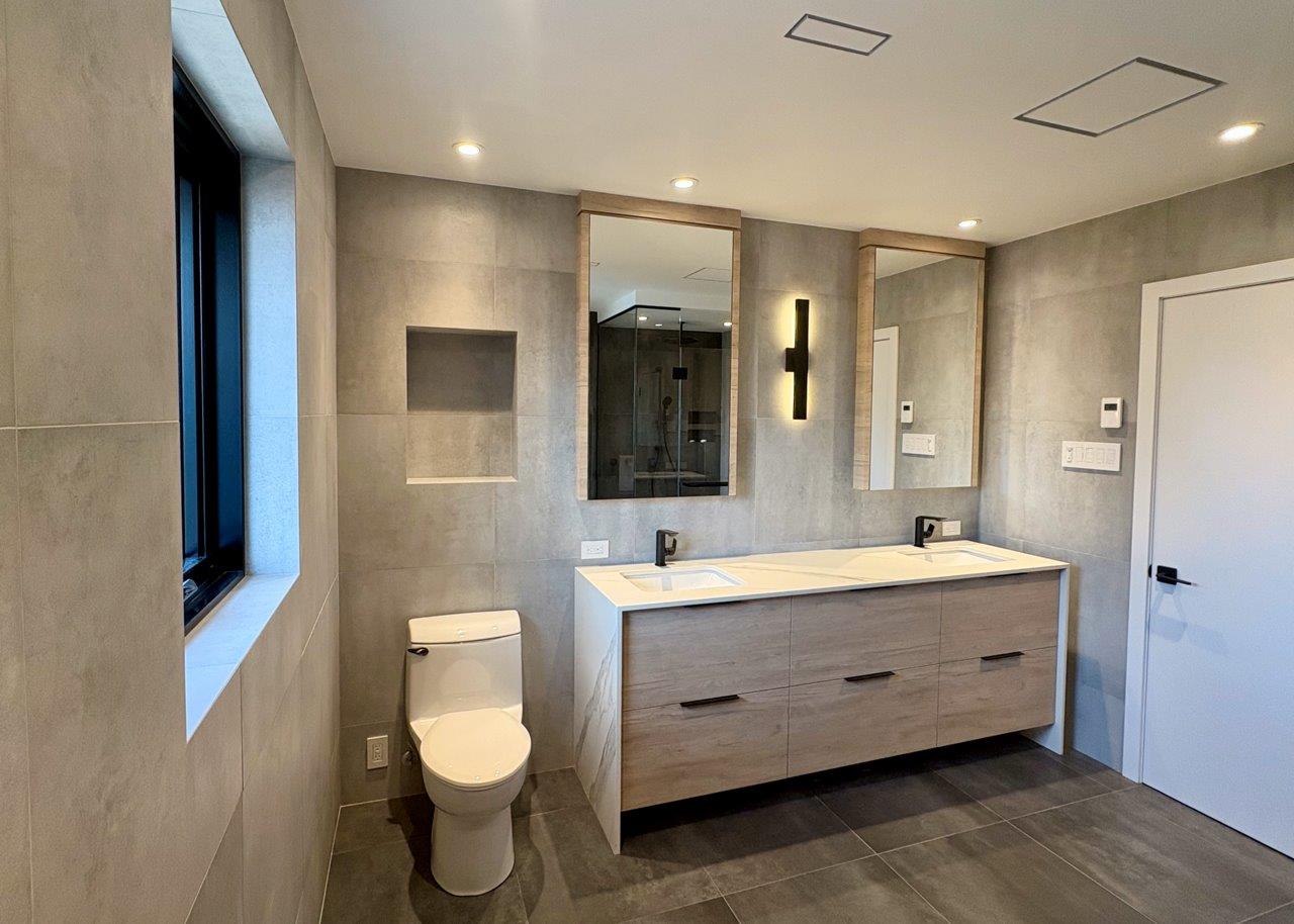 Contemporary living area with open layout and wood floors