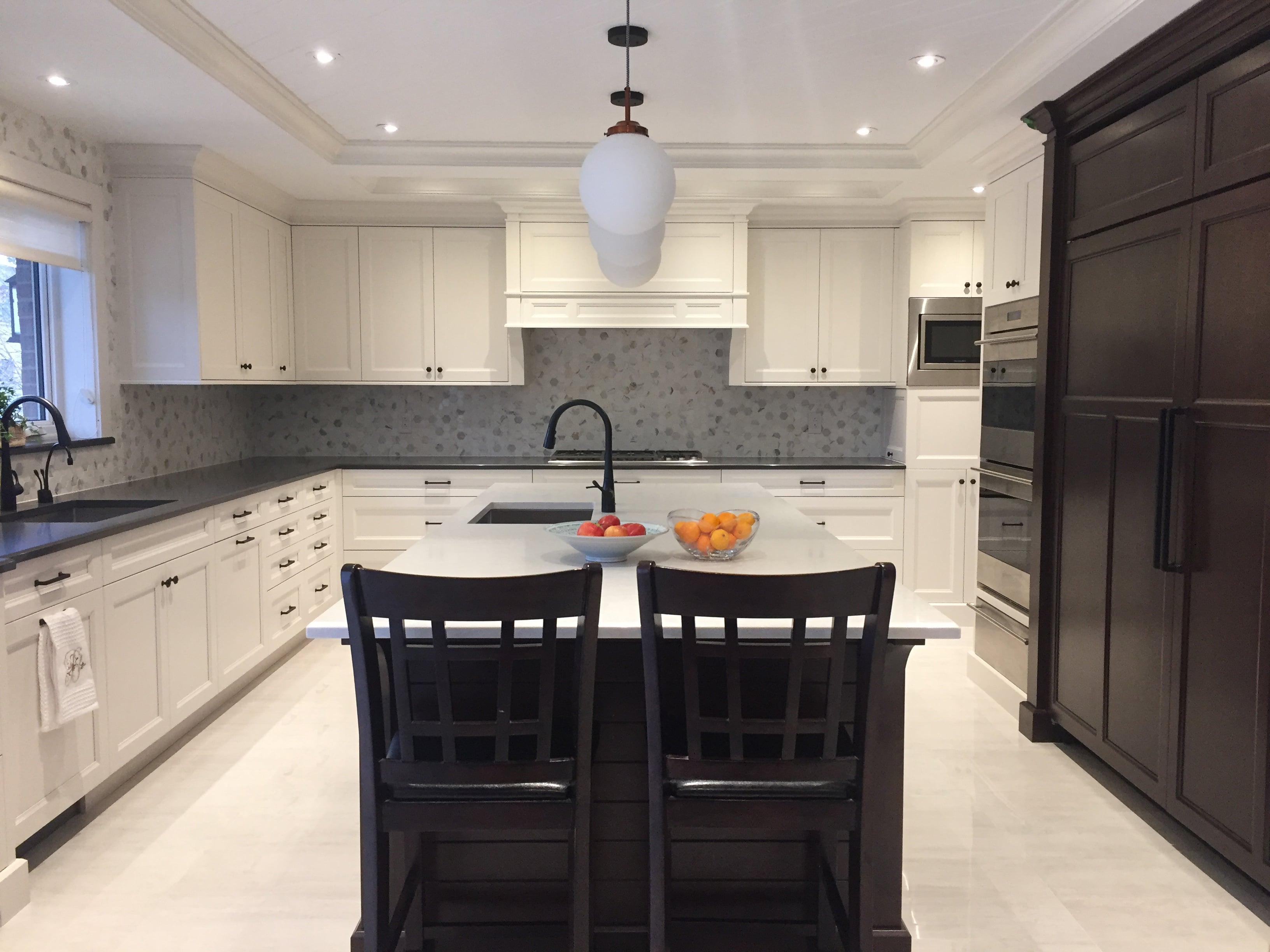 Bright kitchen with skylight and natural wood cabinets