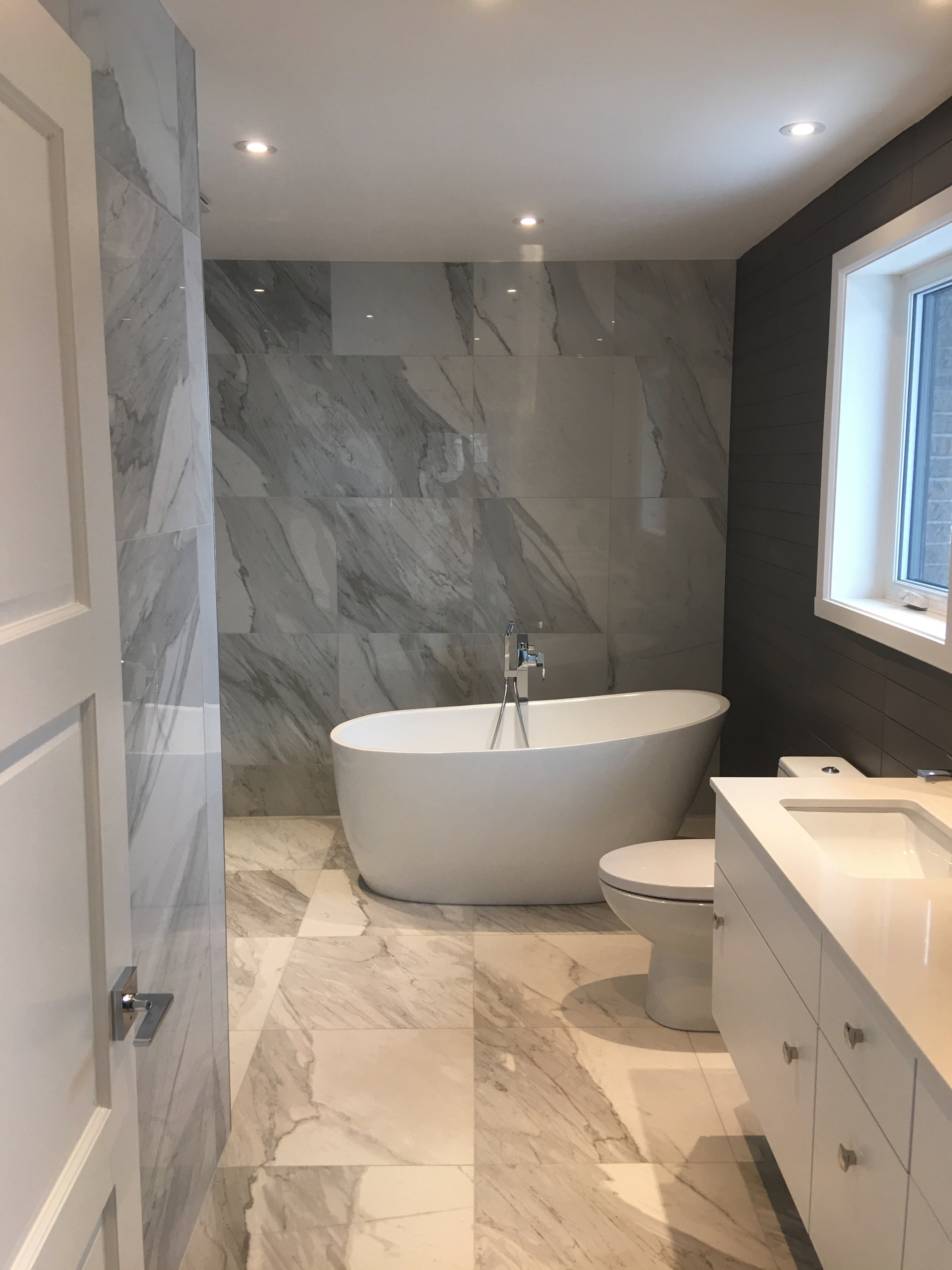 Contemporary bathroom with floating vanity designed