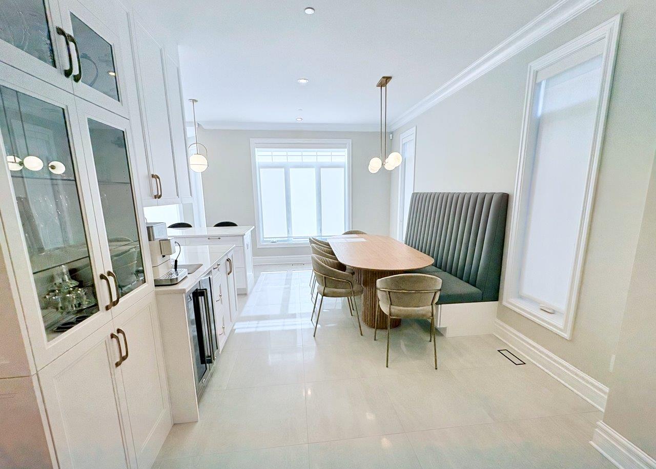Bright kitchen with large windows and bar seating