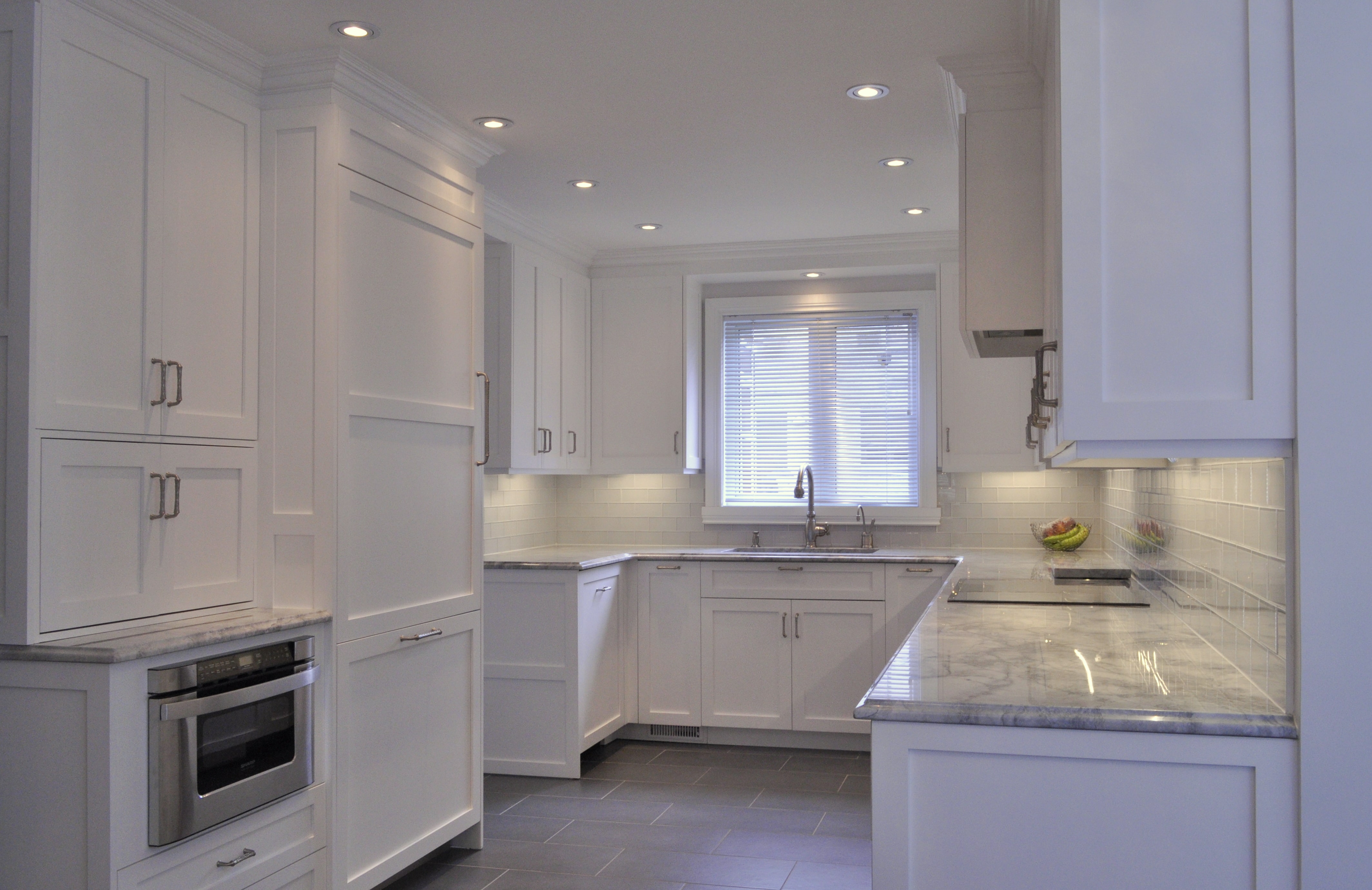 Kitchen with under-cabinet lighting and tile accents-min