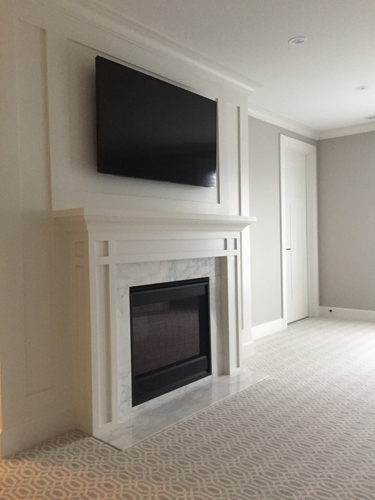 Contemporary living area with open layout and wood floors