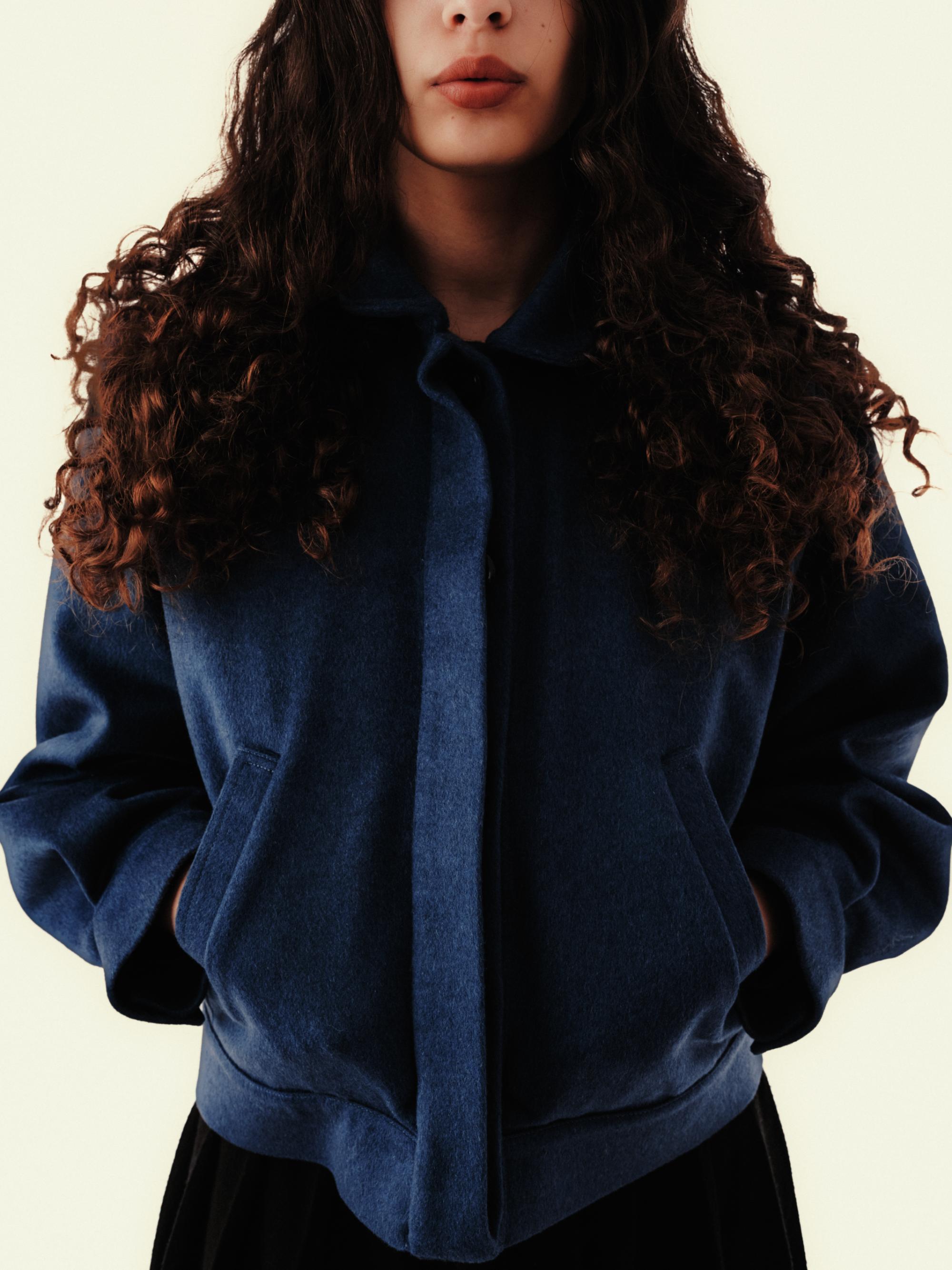 Ines Jacket in deep blue wool and cashmere blend worn by a woman, front view