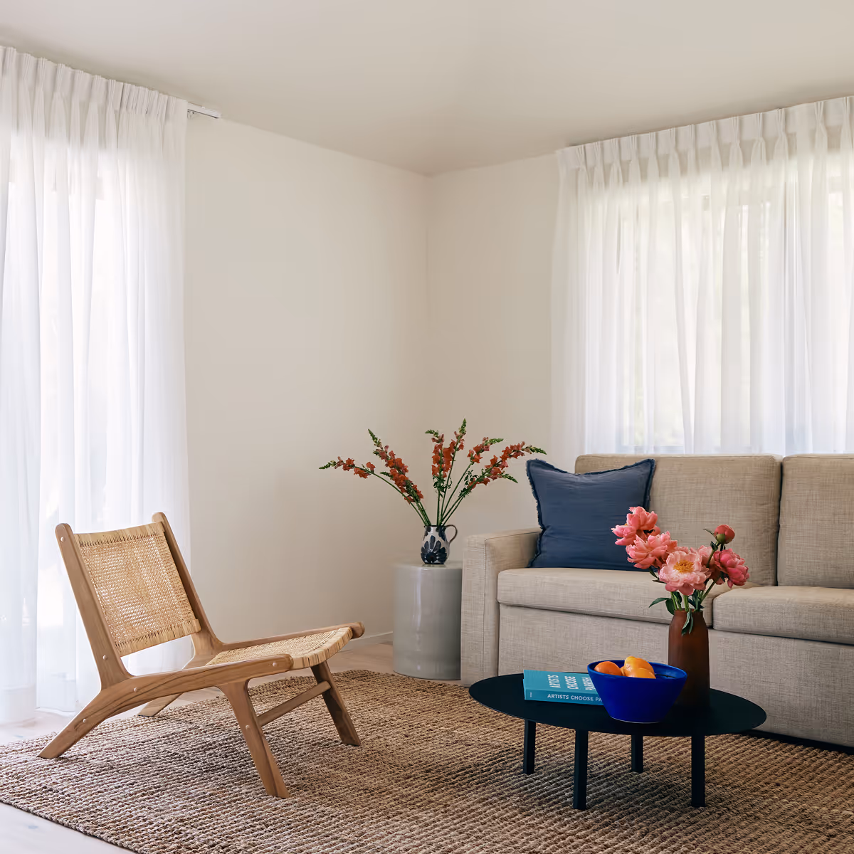 Suite living room with couch, coffee table and chair