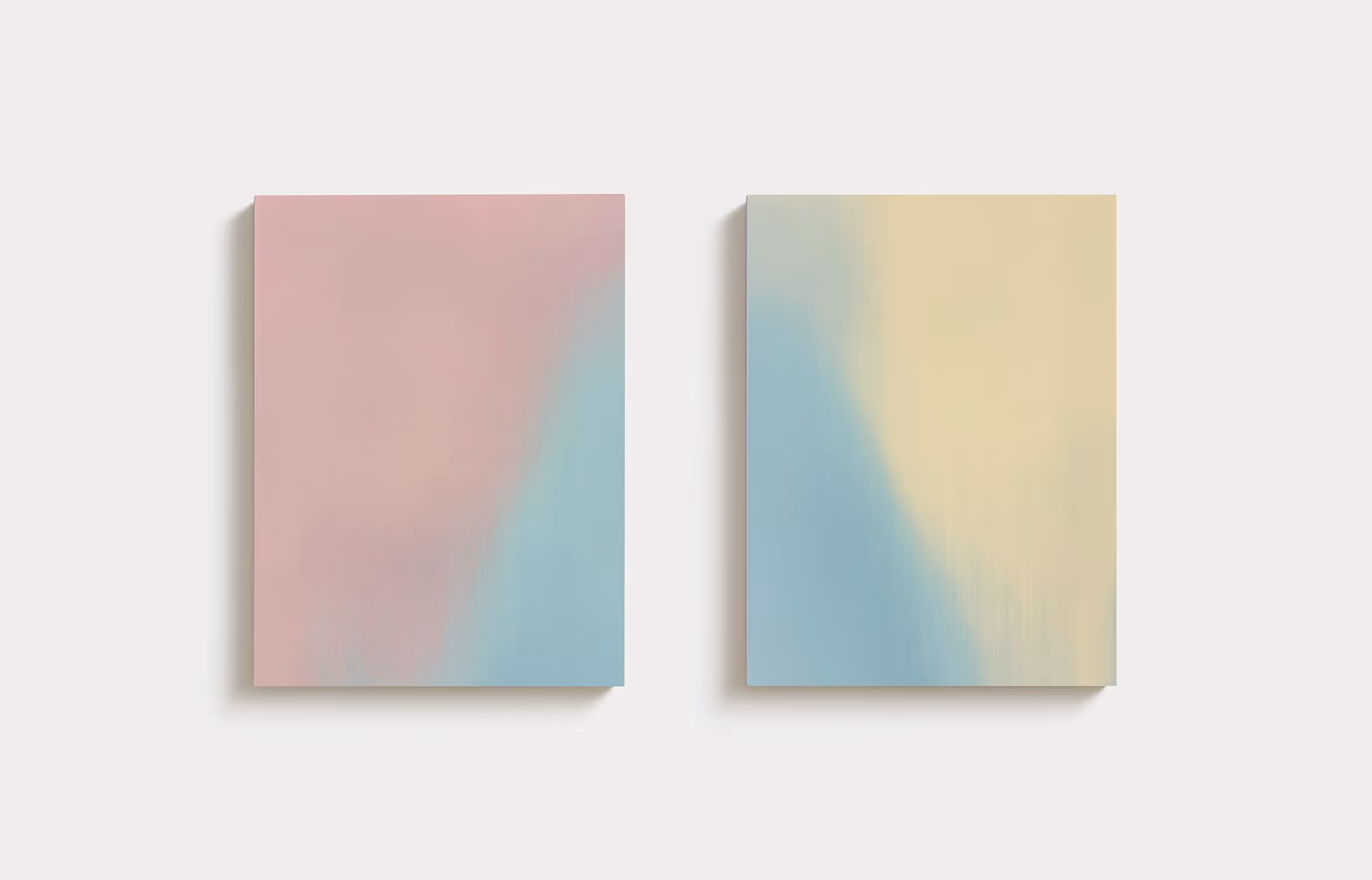 Two vertical rectangle gradient paintings; the left painting diagonally transitioning from dark pink in the top left to blue in the bottom right; the right painting diagonally transitioning from blue in the bottom left to yellow in the top right