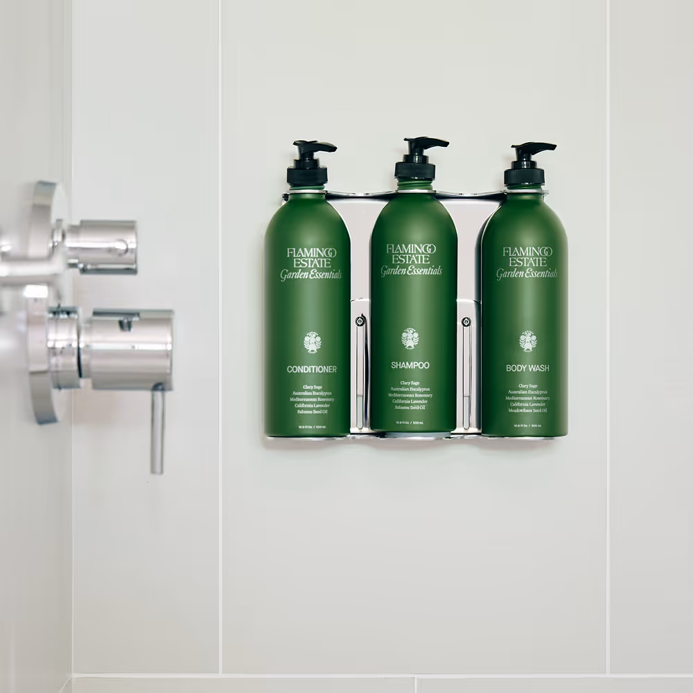 Flamingo Estate greens bottles of body wash, shampoo and conditioner in shower