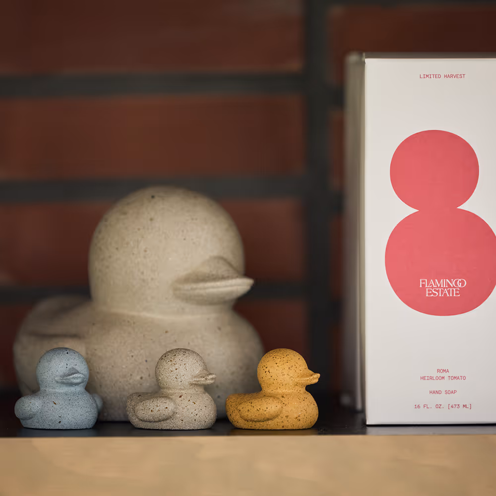 Flamingo Estate packaging of hand soap set to one large and three small sculptures of ducks